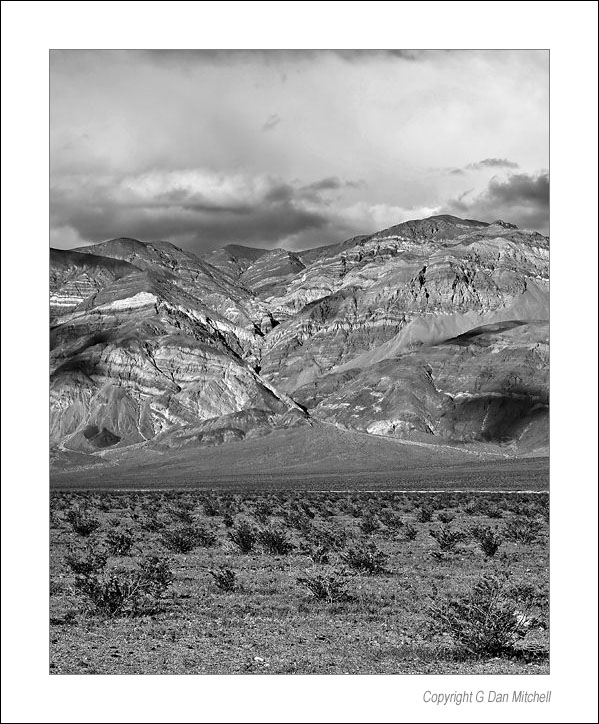 PanamintValleyHills2005: Panamint Valley Hills. Death Valley National Park. March 28, 2005. © "Copyright G Dan Mitchell".    keywords: panamint valley mountains hills storm clouds death valley national park california black and white photograph