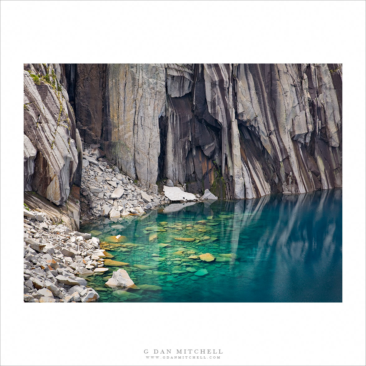 Submerged Boulders, Lake, and Cliffs