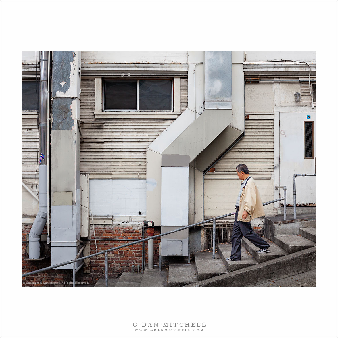 Man Descending Sidewalk Steps