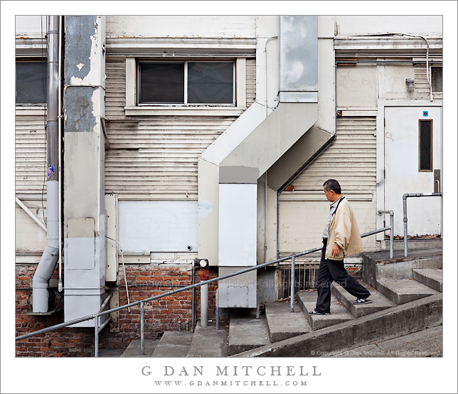 Man Descending Sidewalk Steps