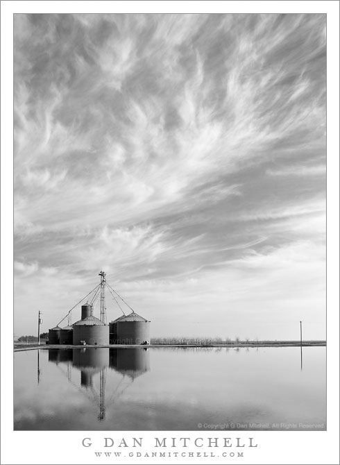 Central Valley Sky, Winter - Thin winter clouds drift about farmland, Central Valley, California.