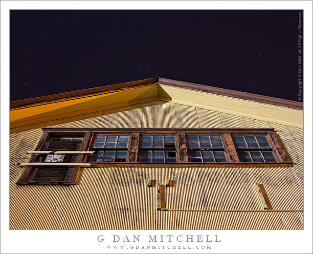 Yellow Building with Weathered Windows, Night Sky