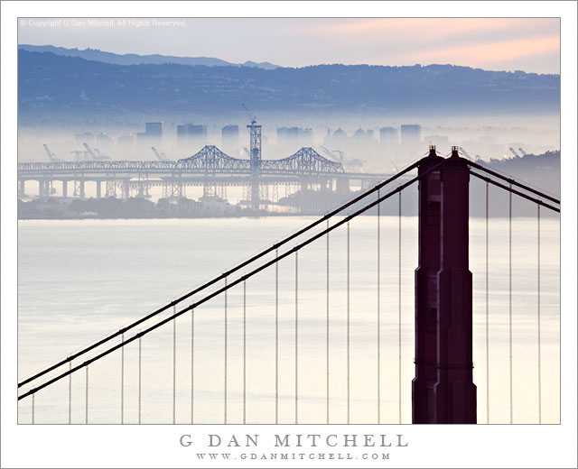 Golden Gate Bridge and San Francisco Bay, Morning Haze - Winter morning haze partially obstructs the view across San Francisco Bay, including the Golden Gate Bridge, Treasure Island, the San Francisco-Oakland Bay Bridge, and the city of Oakland.