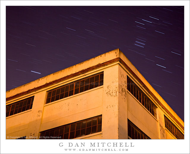 Yellow Building With Dark Windows, Star Trails