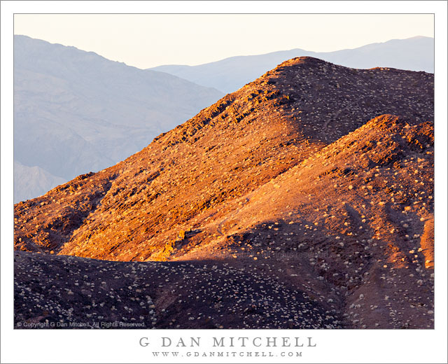 Death Valley Buttes, Morning - Early morning light on the summit of the Death Valley Buttes, with the Panamint Range in the distance, Death Valley National Park, California.