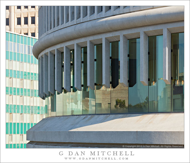 Windows, Davies Symphony Hall - Upper story windows on the curved facade of Davies Symphony Hall reflect the forms of nearby buildings, San Francisco.