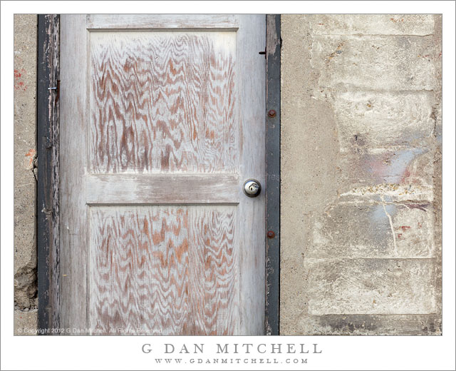 Wooden Door, Concrete Wall - A wooden door in a concrete wall in an alley along The Embarcadero, San Francisco.