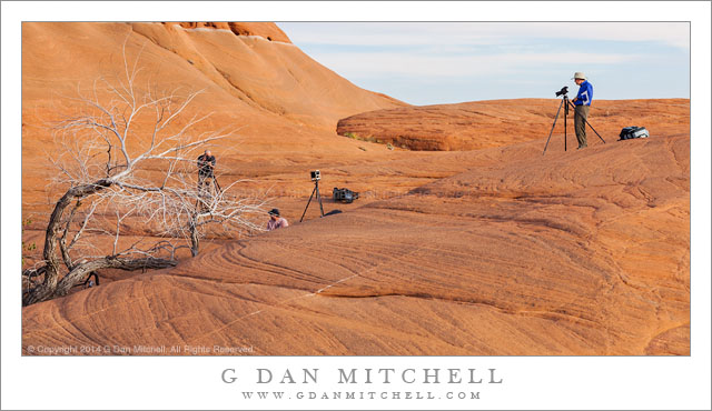 Friends photographing in Utah's red rock landscape