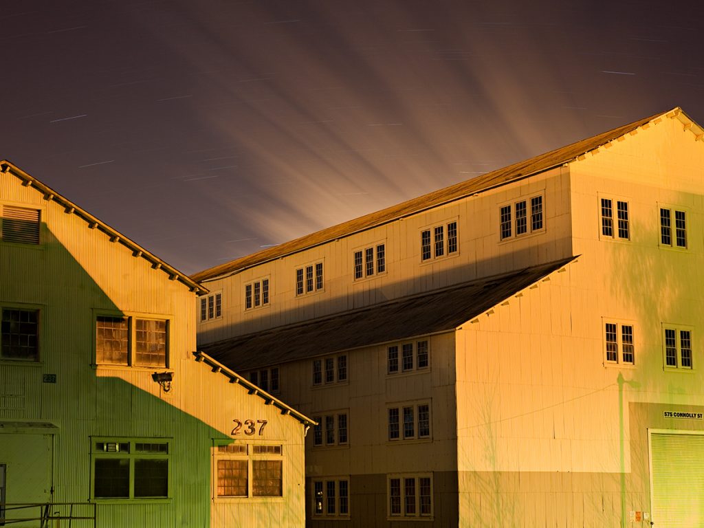 Two Buildings, Shadows, Moving Clouds