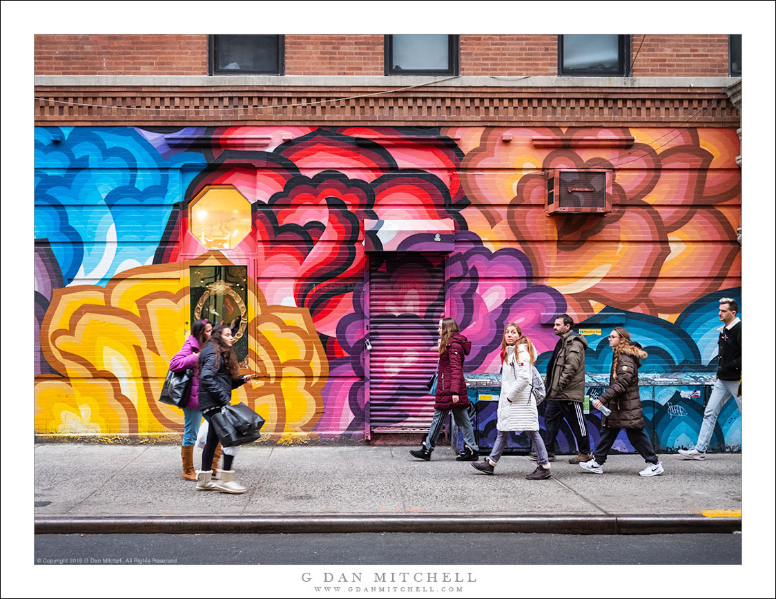 Pedestrians And Colorful Wall