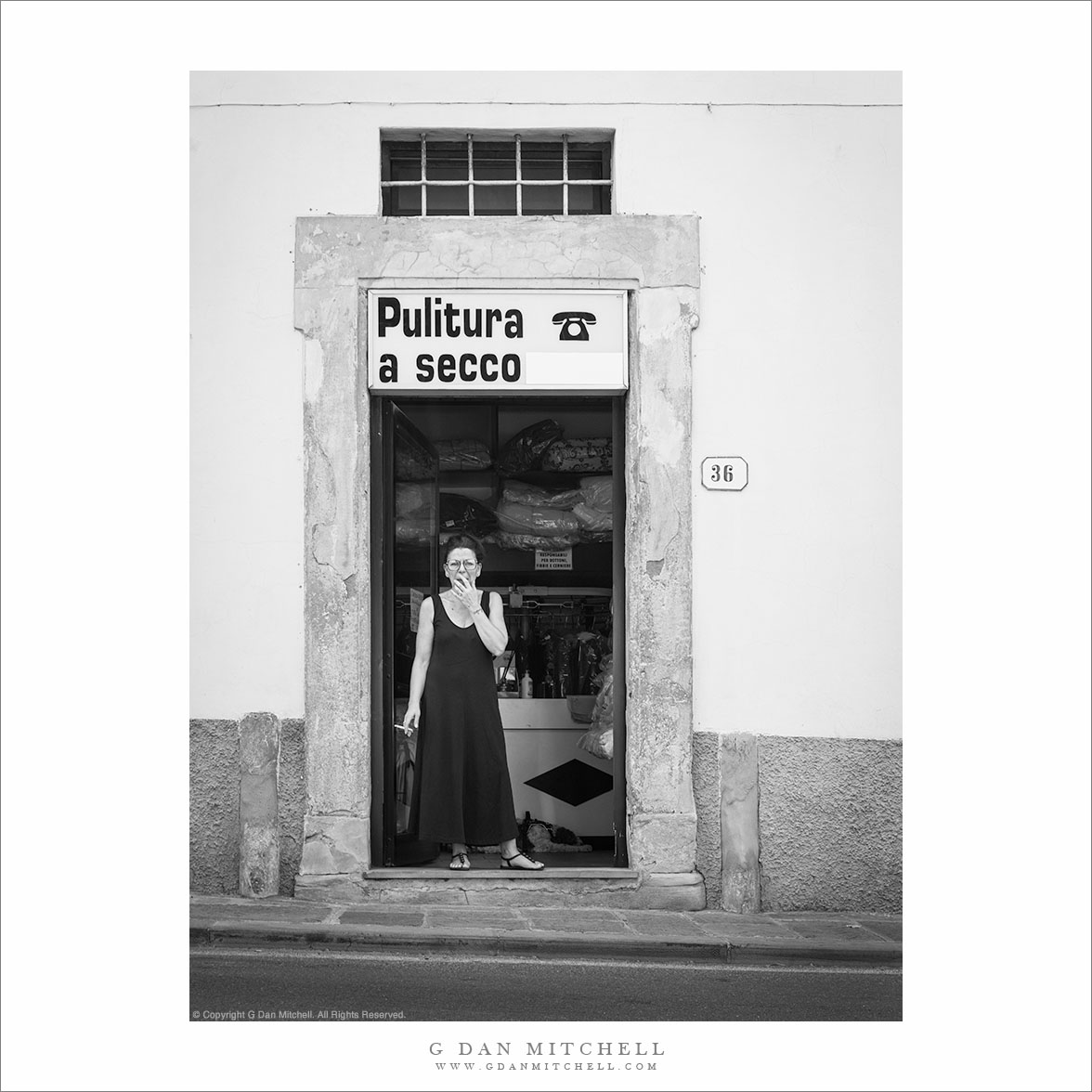 Woman in Dry Cleaner Doorway