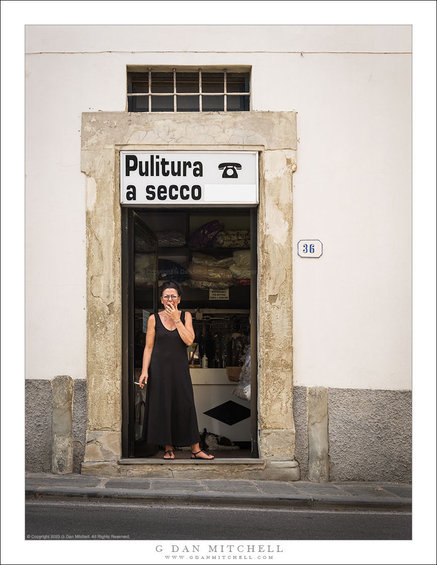 Woman in Dry Cleaner Doorway